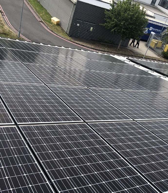 Solar installers on commercial roof
